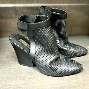 Beautiful black Guess leather open back booties.